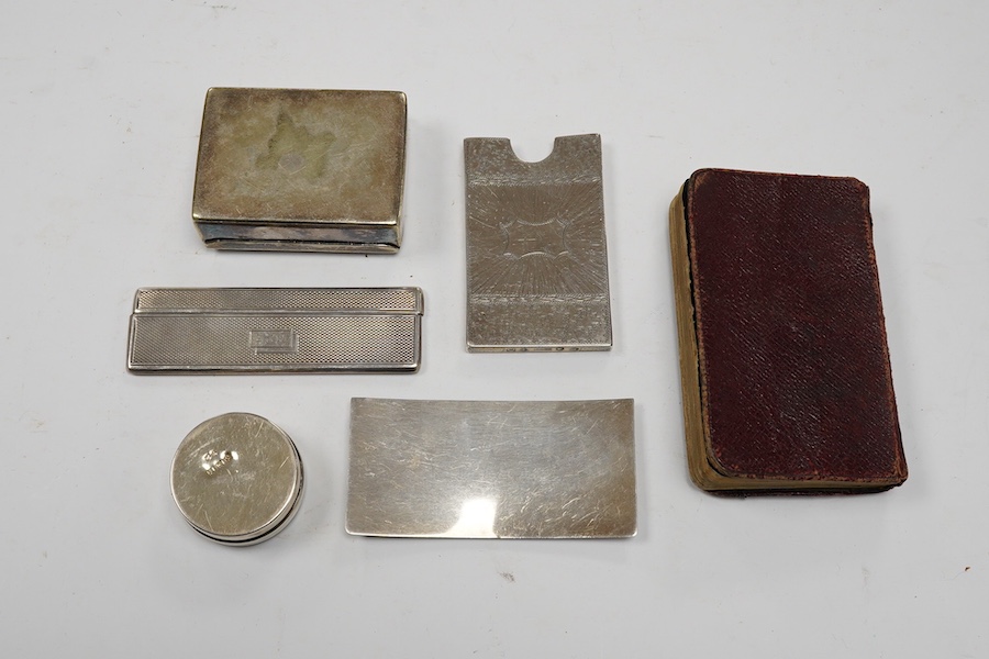 Assorted small silver including an Edwardian inset Scottish hardstone pill box, William Henry Johnson, Birmingham, 1902, 36mm, a mounted prayer book, a card case, cased comb and a plated snuff box. Condition - poor to fa